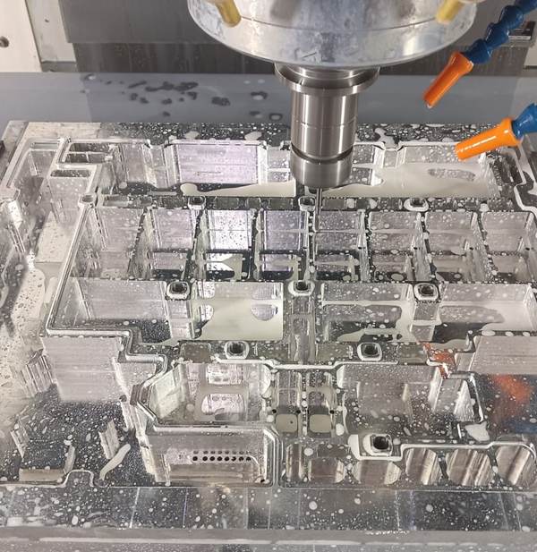 Close-up of a COSMOS vertical machining centre cutting a part